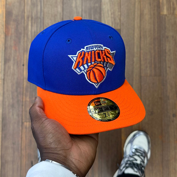 Black daring and orange knicks hat