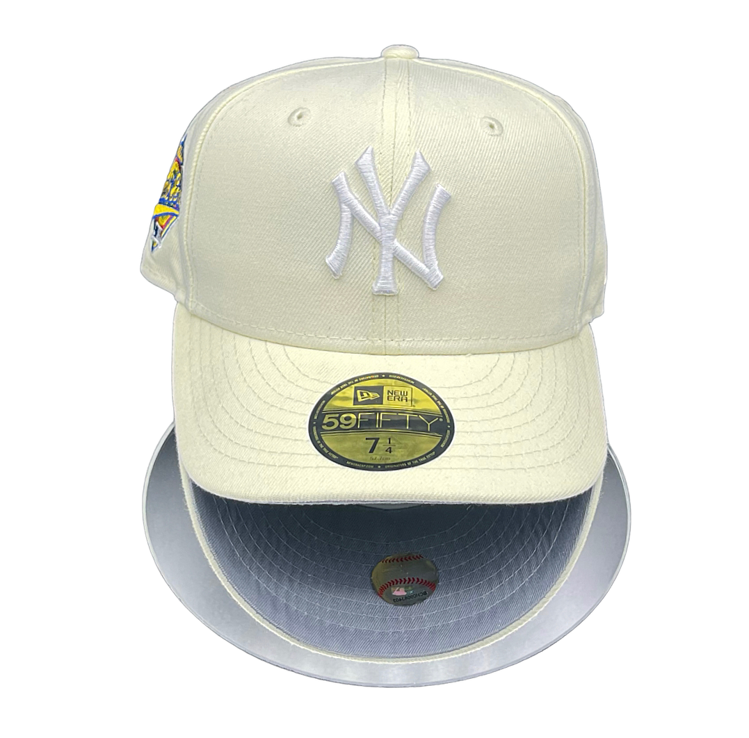 A New York Yankees baseball cap with a chrome white crown and grey UV visor, featuring the team's logo and a 1996 World Series patch.